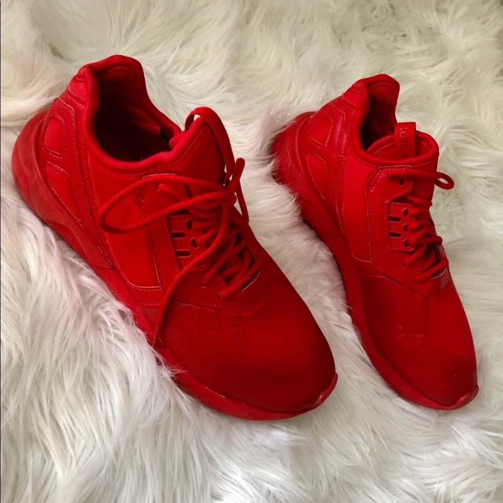 Red Adidas tennis shoes